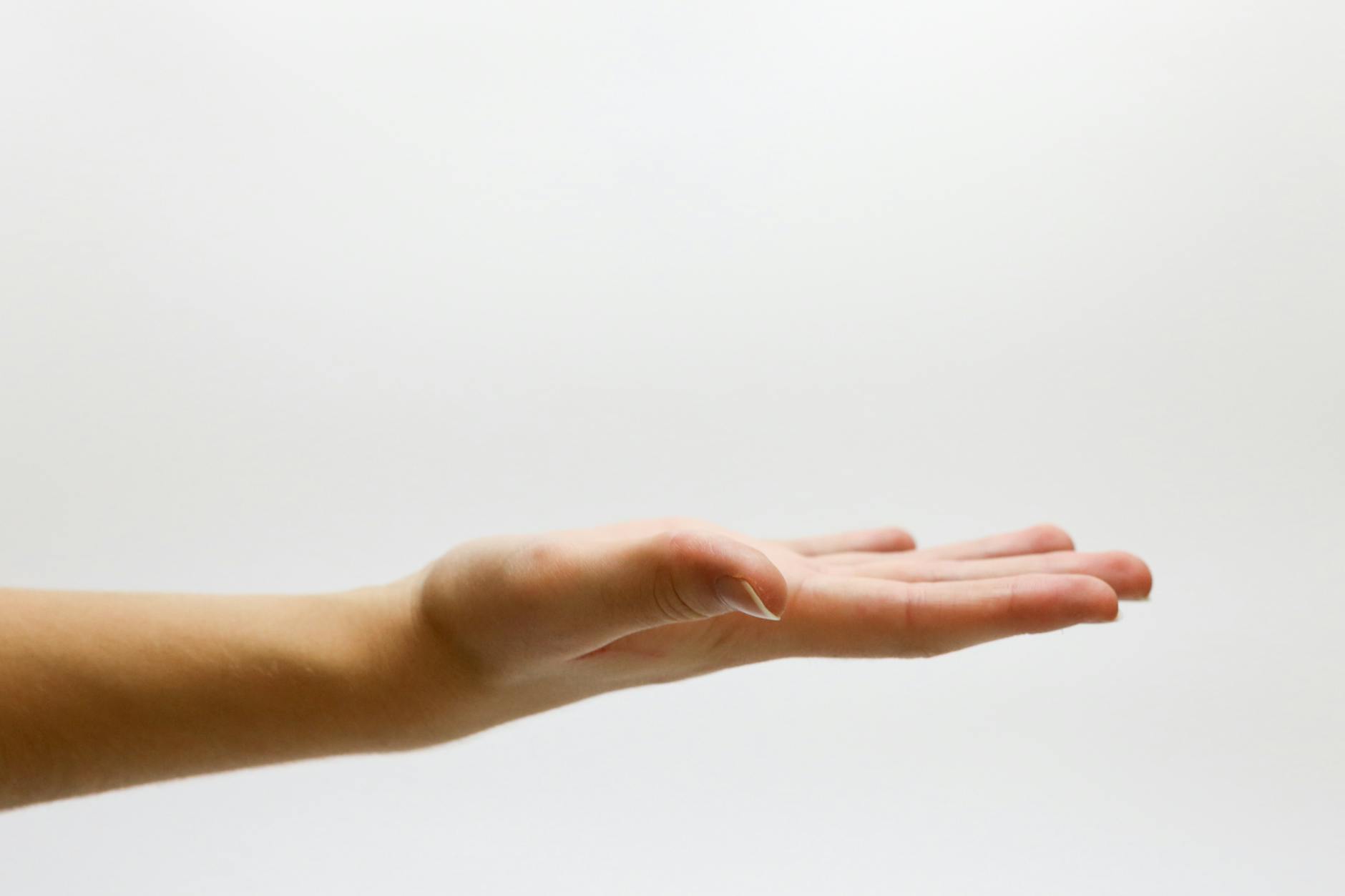 close up of hand over white background